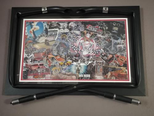 The most popular piece in the MagChop collection is the Motorcycle themed "Iron Freedom" It is custom framed with actual handles from a Harley Davidson Motorcycle. This piece can be found on Buffs, leggings, swimwear, mugs, and as a giclee. It has been featured in the most prestigious galleries. 